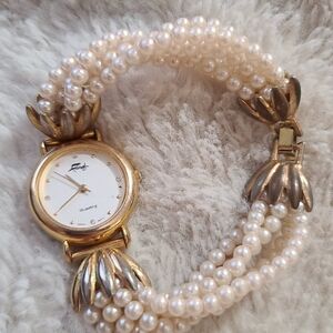 Vtg Faberge Watch Women 25mm Gold toned faux pearl band 7.5"